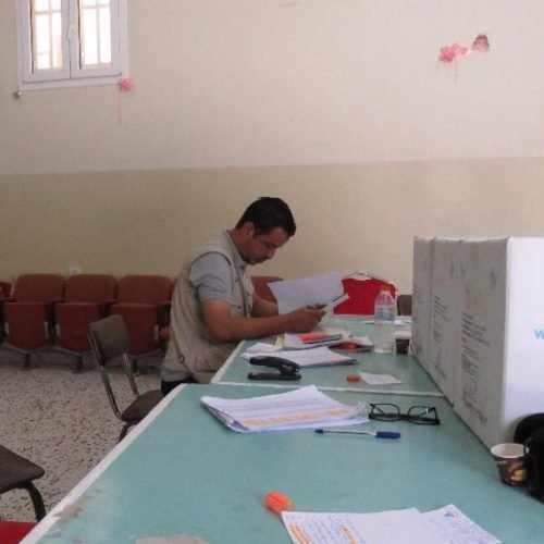 Distributing food aid to displaced families